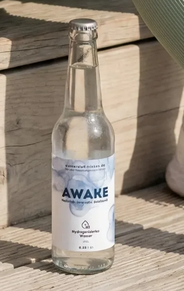 AWAKE glass bottle on a wooden step